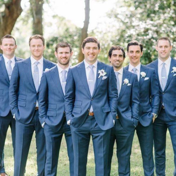 Navy blue suit with light blue tie