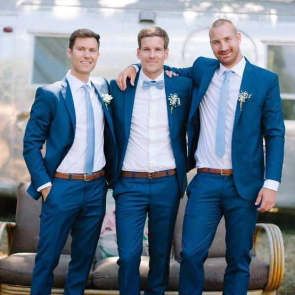 Navy blue suit with light blue tie
